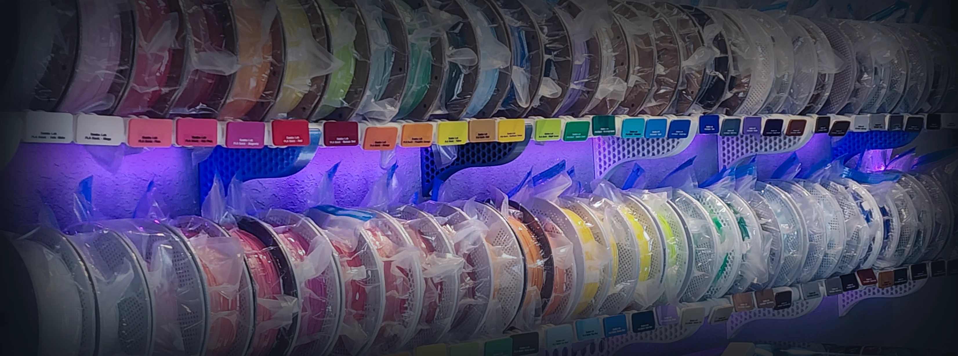 Kamio's filament collection, 416 spools on illuminated wall shelves
